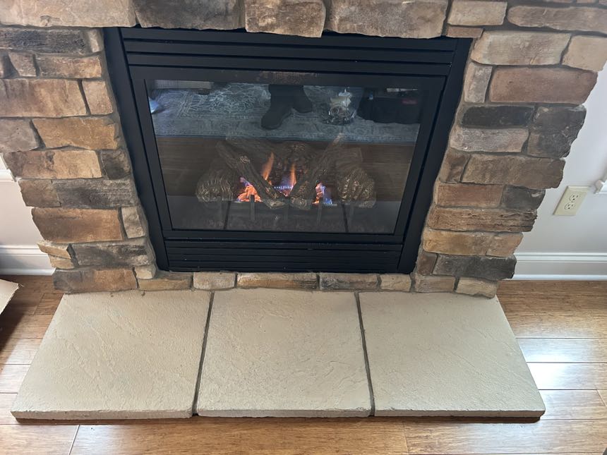 Gas insert in a brick fireplace, burning clean