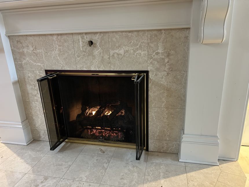 Gas fireplace with safety screen after an annual service